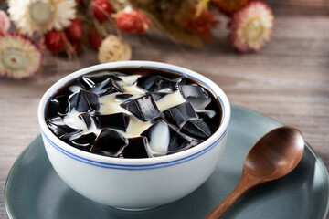 Traditional sweet soup dessert from Guangdong and Guangxi, China, Guilinggao with condensed milk