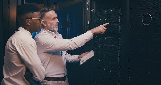 Engineer, people or tablet with inspection in server room for maintenance, backup solution or GDPR. Graphs, team or point to system space for troubleshooting, screen or testing network in data center