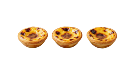Three Portuguese Pastel de Nata pastries, golden flaky crusts, caramelized tops, cinnamon dust, neatly arranged on a clean transparent background, 45-degree view. Professional food display