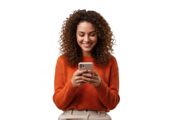 A young woman with curly brown hair smiling while looking at her smartphone, isolated on transparent background