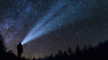 Fototapeta premium night sky observer man with head flashlight pointing light on starry night sky night landscape no logos no brands ar 169