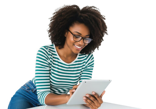 Young african american woman with curly hair wearing glasses and a striped shirt, holding a tablet computer while working or studying, isolated on transparent background