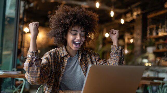 happy excited hipster african american teen girl student with afro hair using laptop computer video conference calling social distance friend in virtual chat winning online sitting at table in cafe n - Powered by Adobe