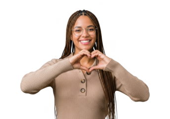 Young woman with braided hair and glasses smiling and making a heart shape with her hands, isolated on transparent background