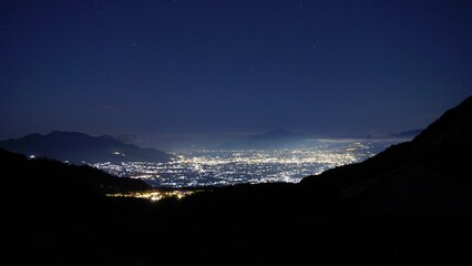 A stunning view of the city lights of Garut at night can be seen from the slopes of Mount...