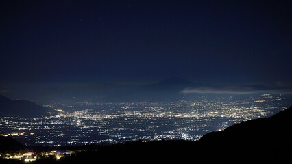 A stunning view of the city lights of Garut at night can be seen from the slopes of Mount...