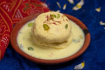 Rasmalai, Rossomalai, Roshmolai, Rasamalei is a very popular Indian dessert. It's a Similar dish to Rasgulla. It is a sweet delicacy made with Indian cottage cheese or chena