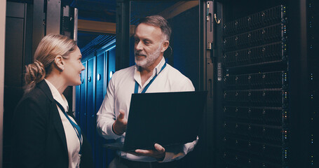 Laptop, collaboration and team of engineers in server room for technical support, database or...