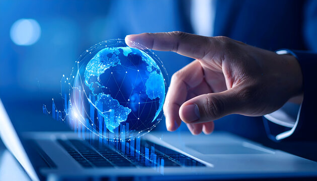 Hand Interacting With A Holographic Blue Digital Globe On A Laptop