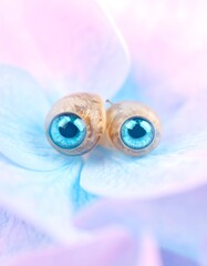 Close-up of stylized eyes on petals