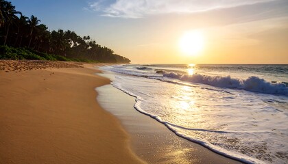 Obraz premium Golden sunset over a tropical beach; gentle waves lap the shore