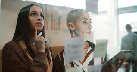 Thinking, women and brainstorming by glass with tablet for research, sticky note and team meeting. Info, insight or decision for agenda with people planning, partner and tech for project management