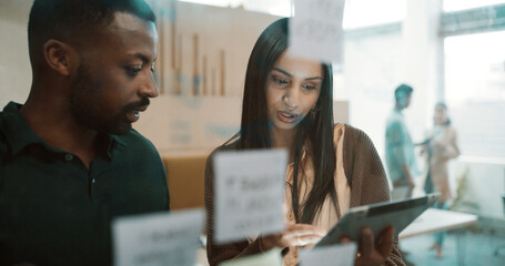 Team, people and brainstorming by glass with tablet for research, sticky note and creative thinking. Info, schedule or vision with employees planning, partner insight and tech for project management