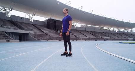Man, athlete and thinking at stadium for training routine, challenge and outdoor on track. Person,...