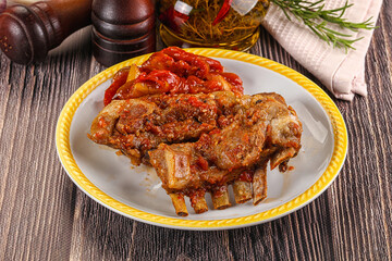 Baked lamb ribs with vegetables