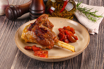 Baked lamb shank with vegetables