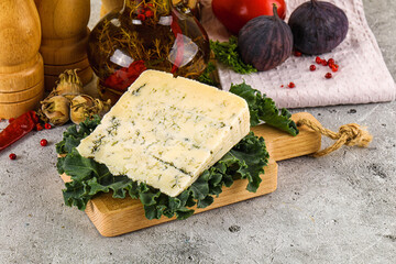 Blue cheese piece over board