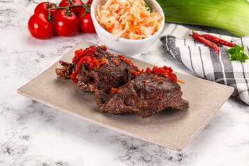 Baked beef cheeks with vegetables