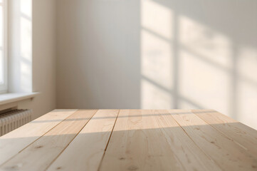 Light wooden table with sunlit window shadows on wall and radiator pine wood plank table