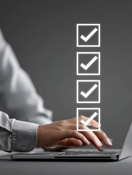 Efficient Task Management Boost Productivity with Digital Checklist on Laptop and Hands Checking Off Completed Tasks for Better Work Organization