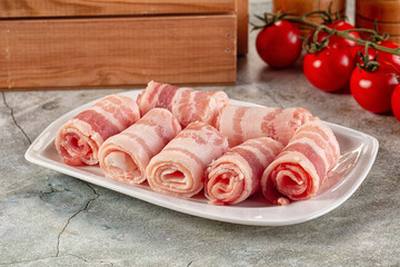 Raw bacon pork roll sliced