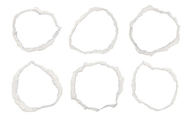 Six abstract white rings with rough textured edges on a black background