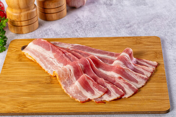 Raw bacon pork meat slices