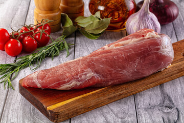 Raw pork sirloing over board