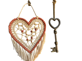 Crocheted heart macrame with antique key isolated on a transparent background handmade rustic