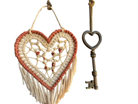 Crocheted heart macrame with antique key isolated on a transparent background handmade rustic