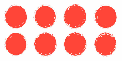 Eight abstract red circles with a distressed grunge texture on a white background