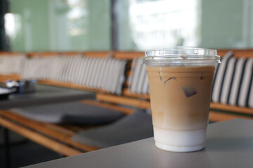 Iced latte served in cafe on a sunny afternoon