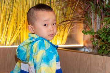 a little boy looking at camera