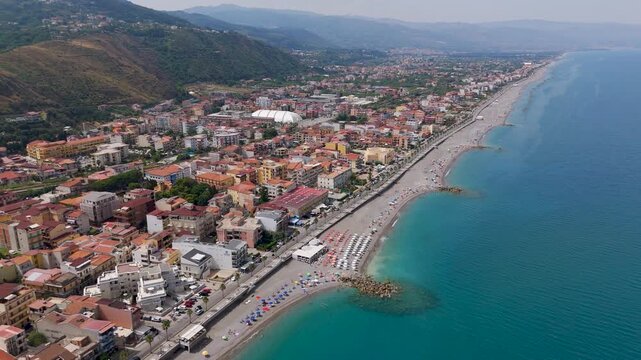 Aerial Drone Shot Over Capo D'Orlando Town and Coast, Messina, Sicily, Italy on a Bright Summer Day.
