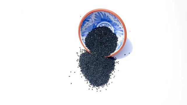 Kalonji Seeds on White Background. High Angle View.