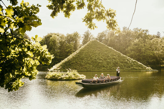 Tourists spending vacation in boat at Park Branitz, Cottbus, Germany
