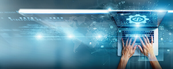 Programmer using a laptop with software development data coding practices, agile workflows, testing...