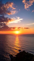 Obraz premium Ocean Sunset View from Coastal Clifftop