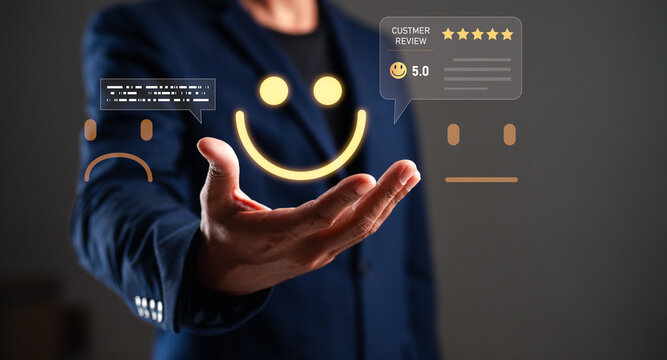 A businessman displays customer feedback with emoticons, symbolizing satisfaction and ratings, emphasizing the importance of customer reviews.