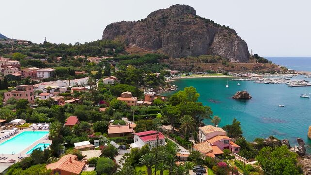 Low Pass Aerial Drone View Of Porto di Cefalu And The Bay In Cefalu, Sicily, Italy.