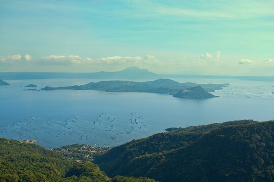Aerial view of the serene lake surrounding the volcanic island, a tranquil scene of nature's artistry, Tagaytay, Cavite, Philippines.