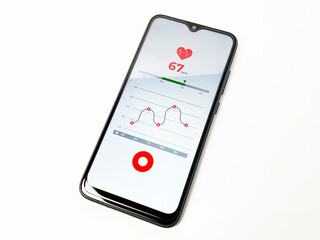 Close-up of a smartphone screen showing a heart rate monitor application