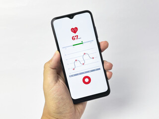 Hand holding smartphone displaying heart rate monitor application - isolated on white background