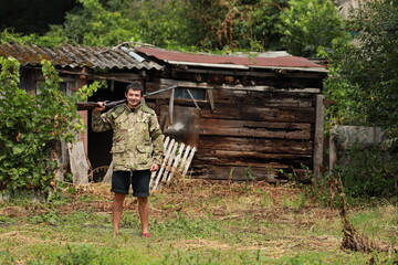Hunter in camouflage jacket with antique double-barreled shotgun