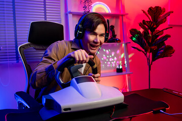 Asian young esport male gamer playing online video game on computer. 