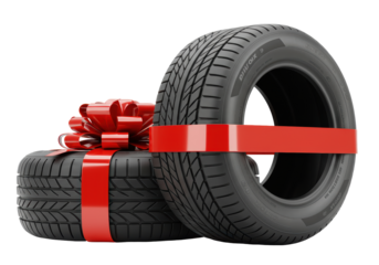 Isolated gift of two car tires wrapped with red ribbon, perfect for automotive promotion, season deals