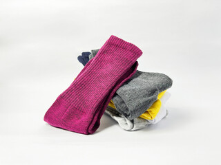 Colorful Socks Stacked on White Background