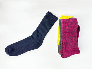 Colorful Socks Stacked on White Background