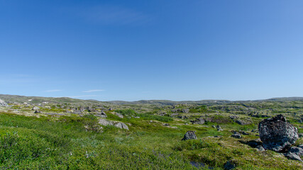 landscape Russian North view in the tundra with a mountain river and a lake in the mountains