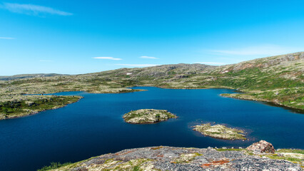 Obraz premium landscape Russian North view in the tundra with a mountain river and a lake in the mountains